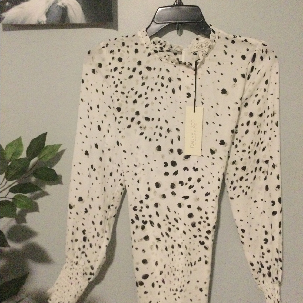 Blouse with dot details. Very light, semi sheer. Never worn.